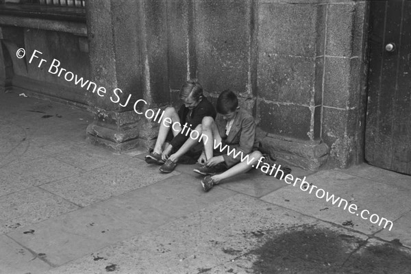 BOYS AT KINGSBRIDGE DRYING FEET